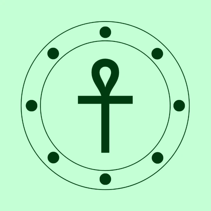 A green shield sticker shows an ankh